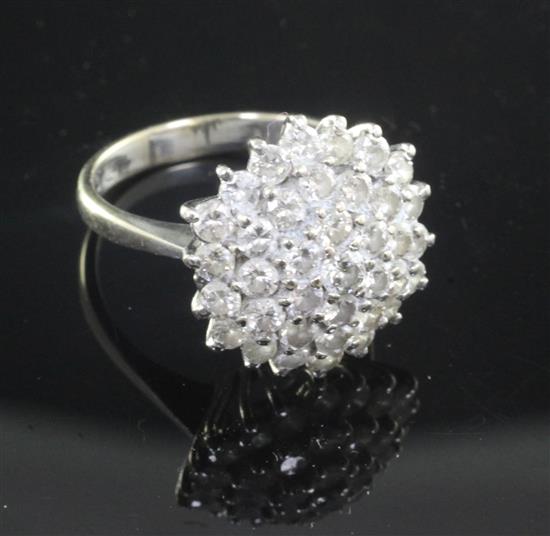 An 18ct white gold and diamond cluster ring, size N.